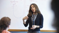 Faculty from the Columbia Academy for Psychoanalytic Educators (CAPE) teaches in front of classroom.